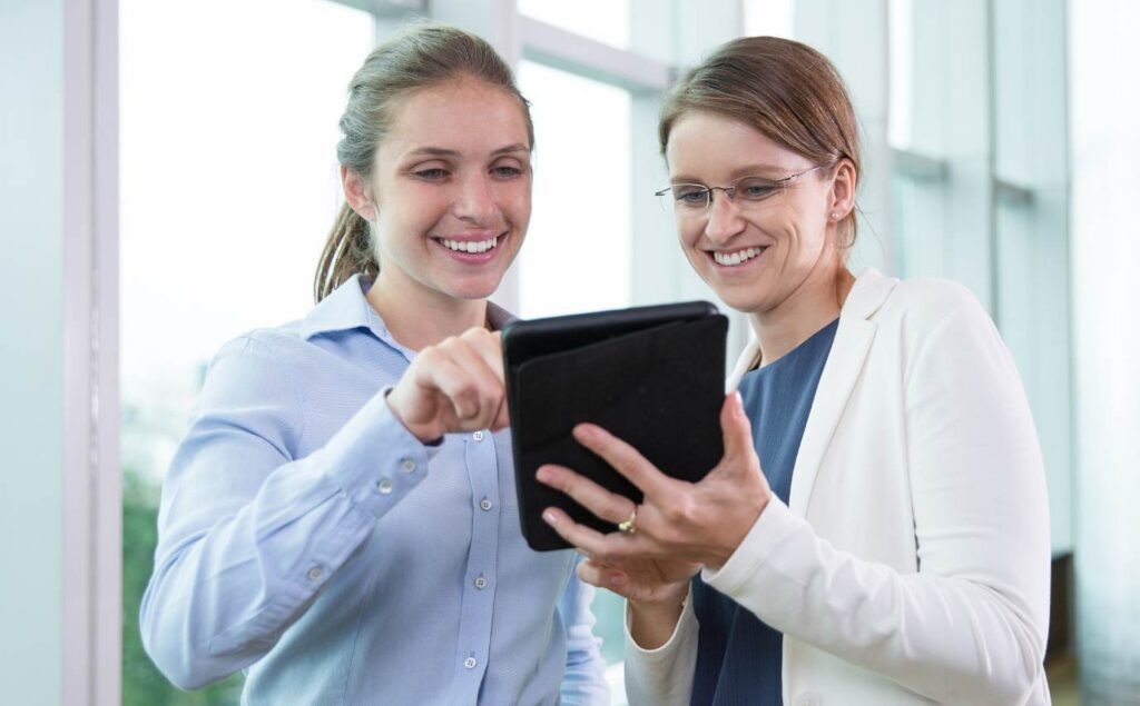 Professionals reviewing successful drug rehab advertising results.