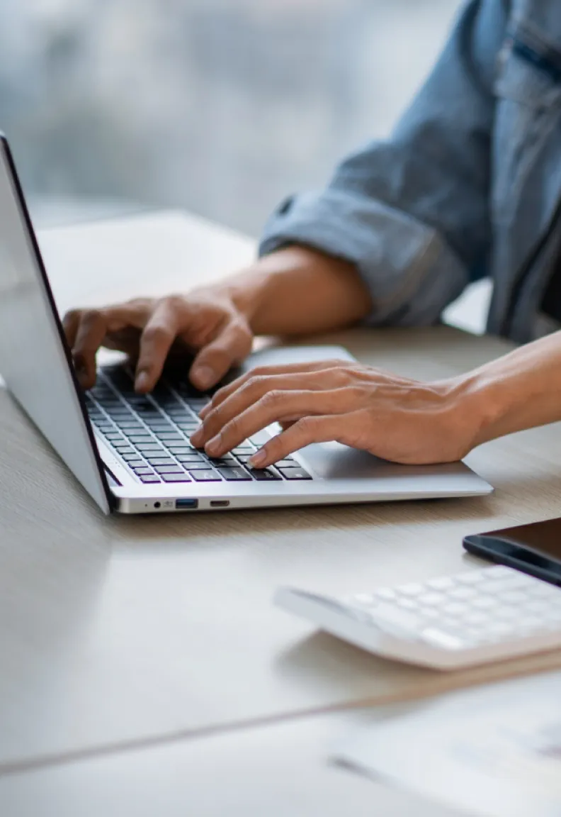 Man using laptop for a digital marketing project.