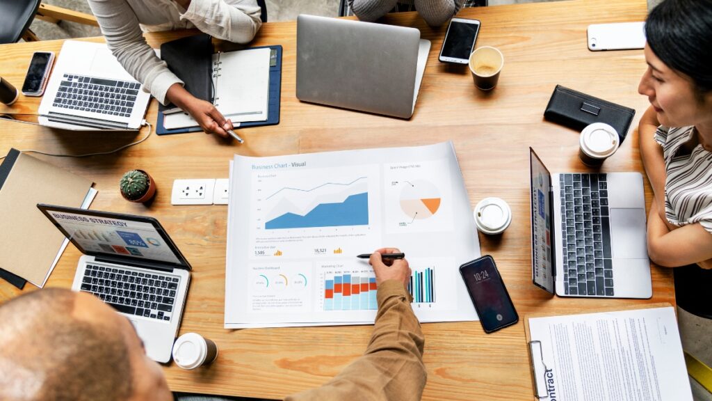 A team shares their findings through lead generation research.