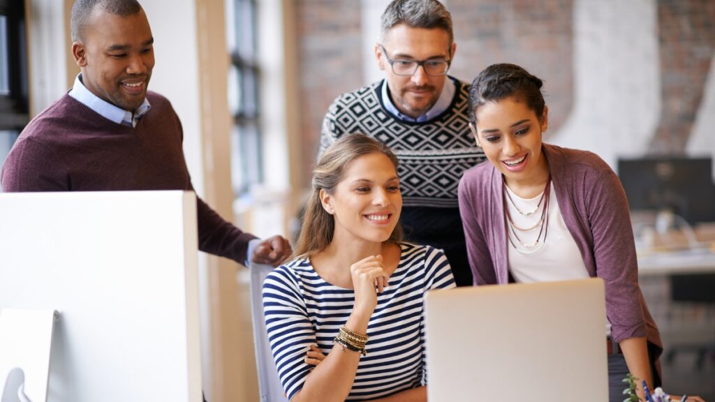 A team encourages one another and shares their ideas during our email marketing services