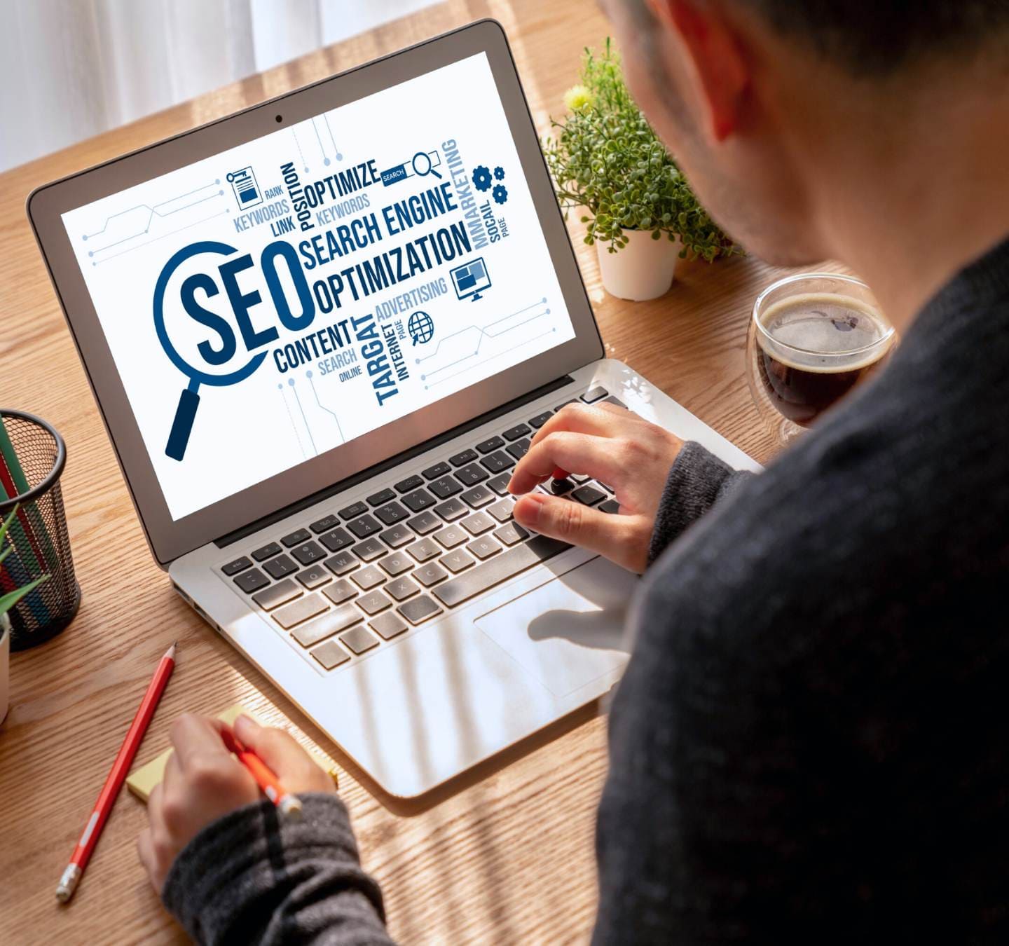 A man learns the best practices of search engine optimization through an SEO agency.