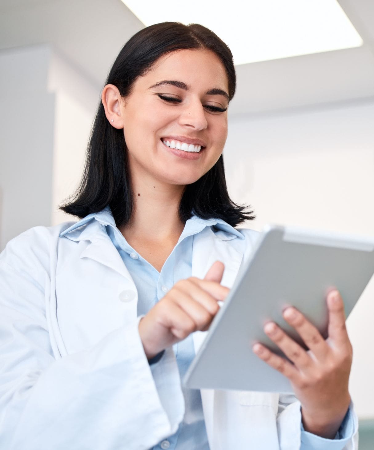 Woman evaluating behavioral health marketing with satisfaction.