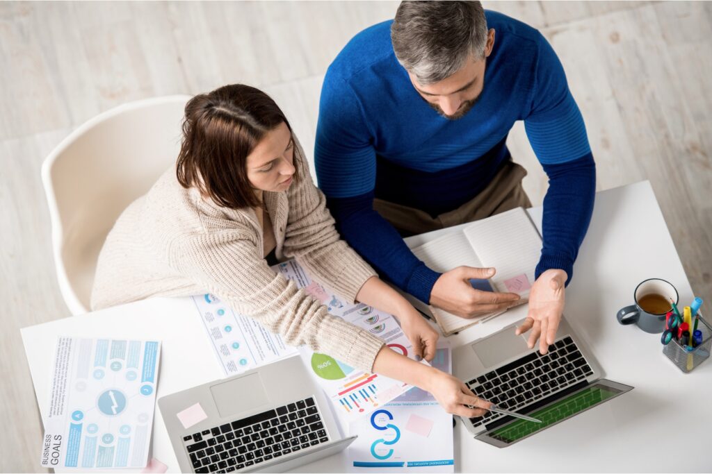 Team reviewing marketing strategies for health and wellness coaches.