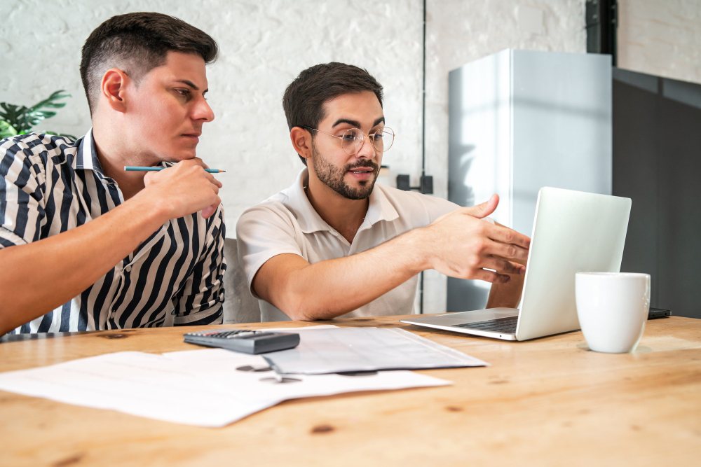 Couple managing business information online using Google Business Profile tips from Stodzy Internet Marketing